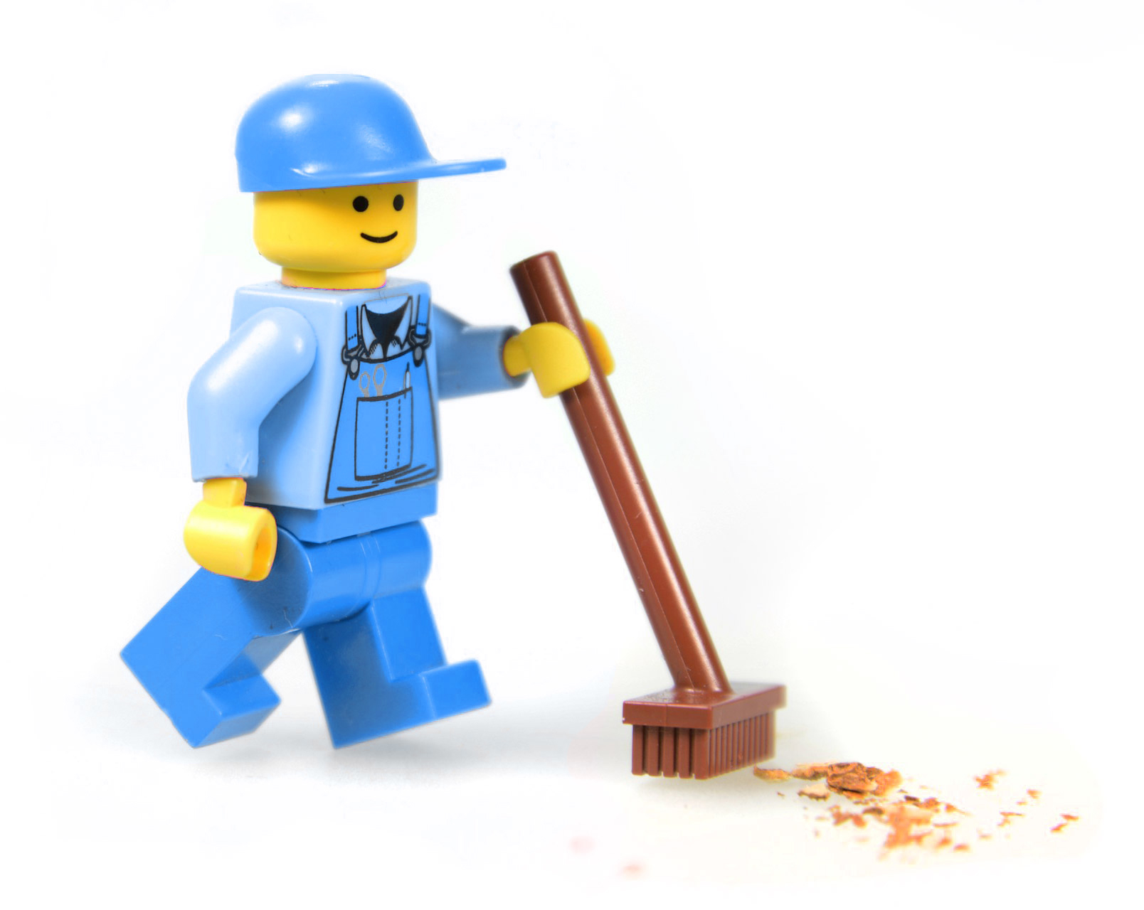 Lego man cleaning with a lego broom